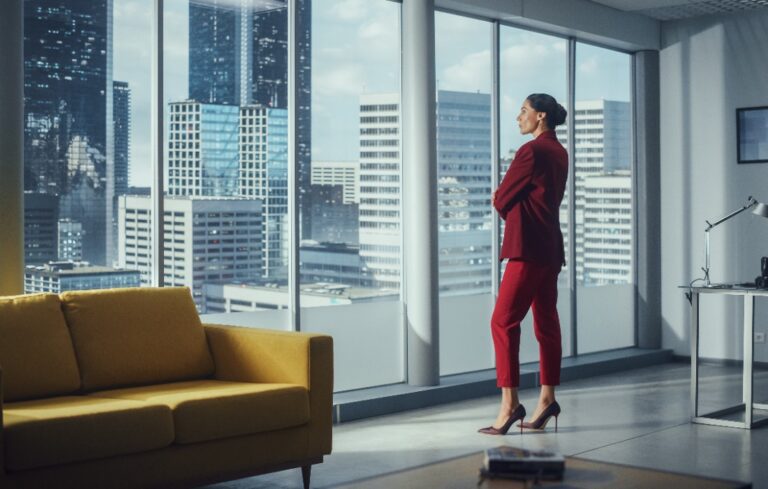 Female executive contemplating job options, highlighting the need for smart onboarding.