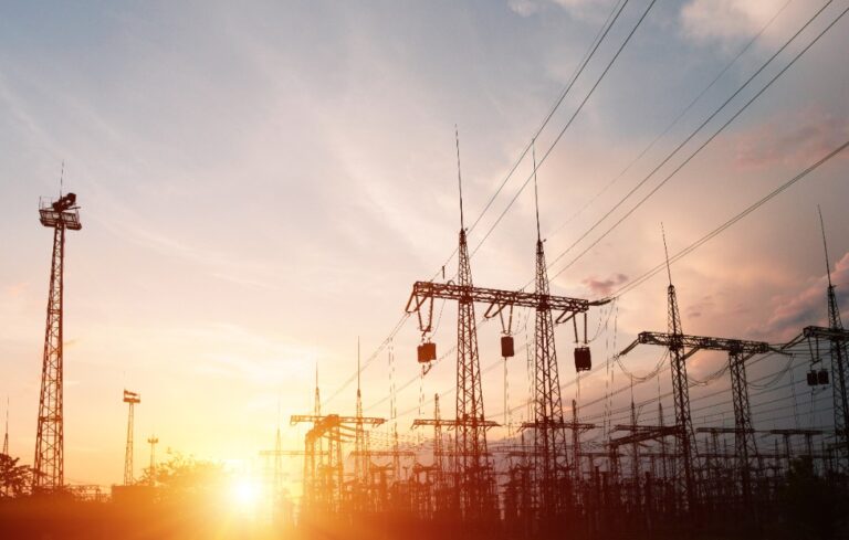 High-voltage power lines. Distribution electric substation with power lines and transformers