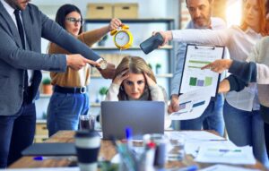 Group of business workers working together. Partners stressing one of them at the office