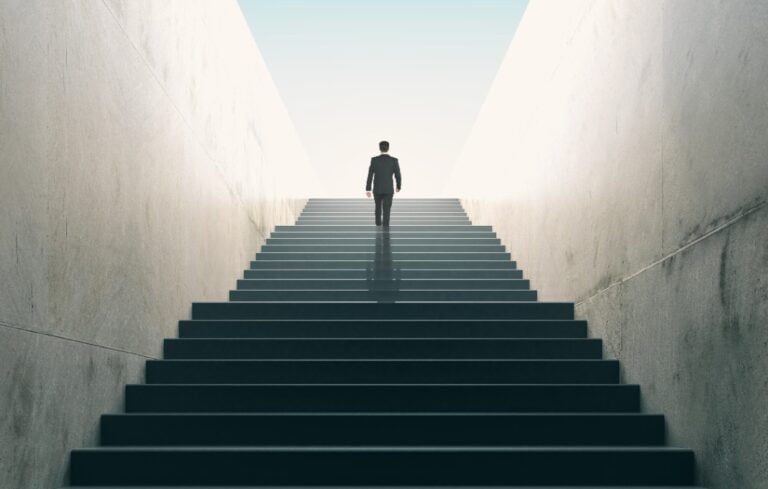 businessman climbing stairs