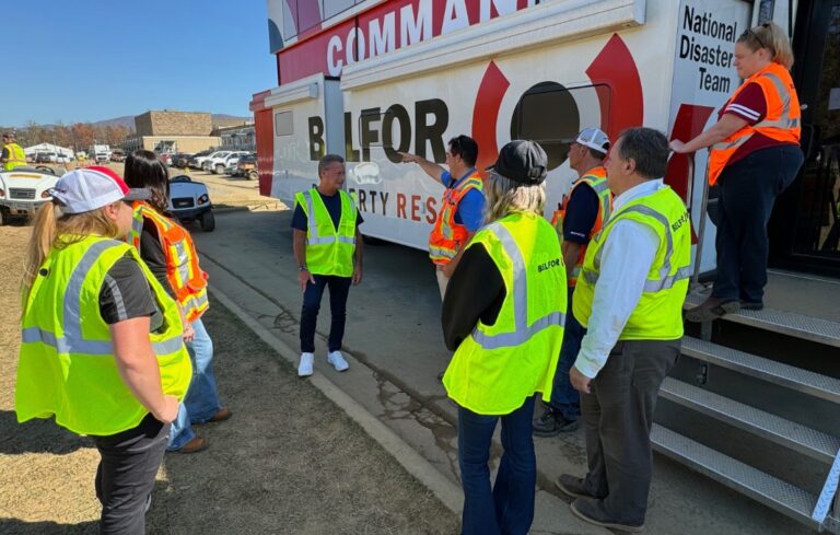 Sheldon Yellen, CEO of BELFOR Property Restoration, meets with team members on site during a disaster response operation.