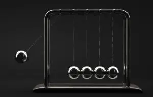 Newton's cradle on black background