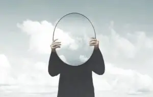 Illustration of woman in black holding a surreal mirror among clouds, surreal abstract concept