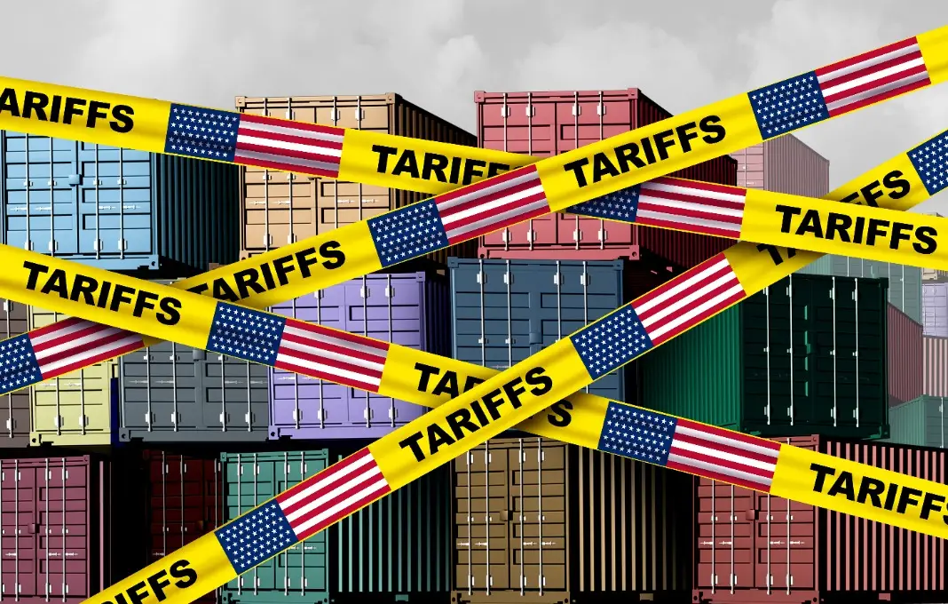 Caution tape printed tariffs in front of shipping containers