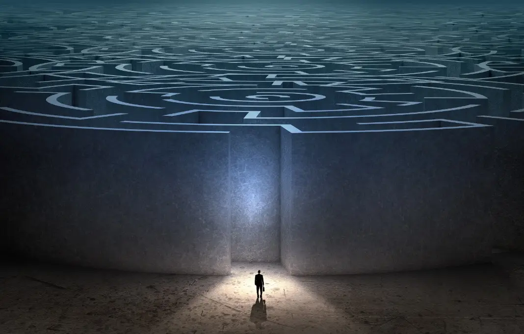 Businessman facing down maze