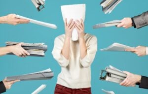 an office worker hid behind a document