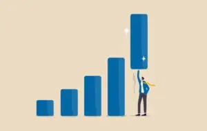 businessman help lift up bar graph to new high