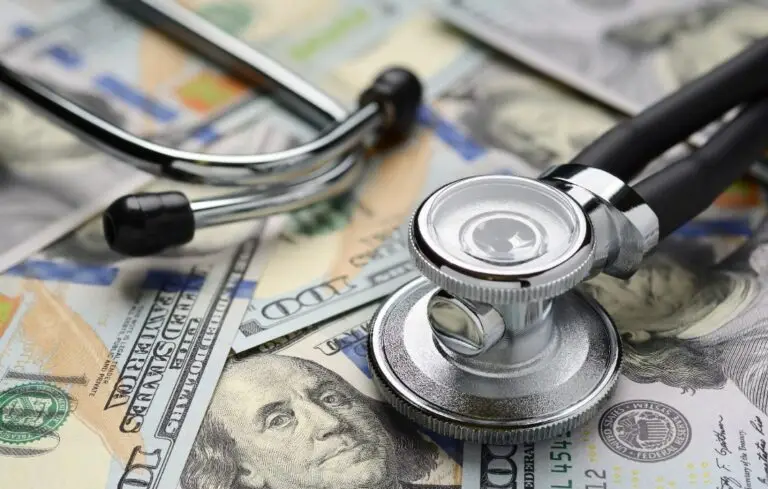 Medical stethoscope and dollar bills