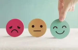 Hand choosing happy smile face paper cut,
