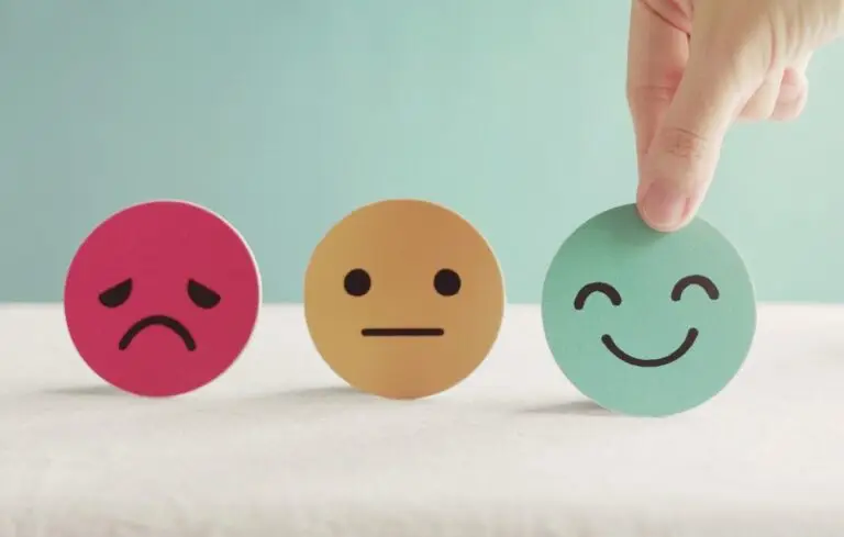 Hand choosing happy smile face paper cut,