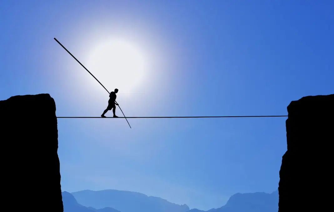 Tightrope Walker Balancing on the Rope