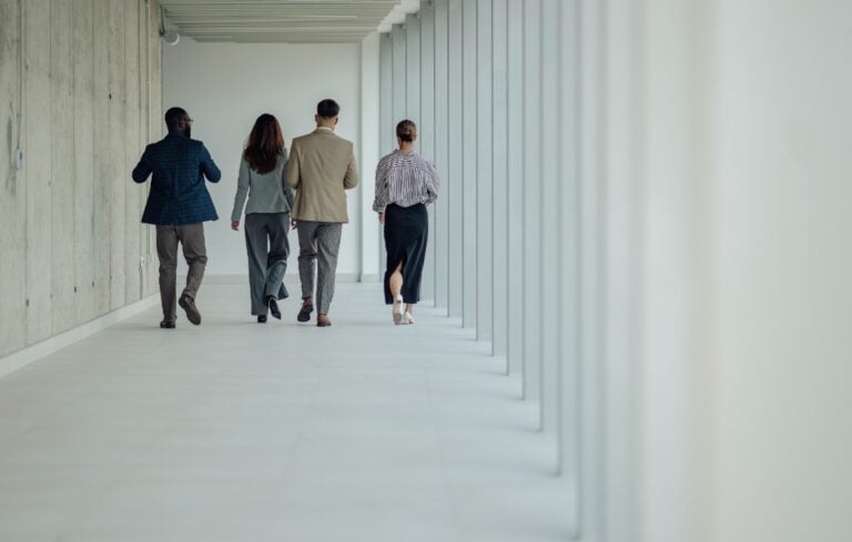 Group of business people walking away