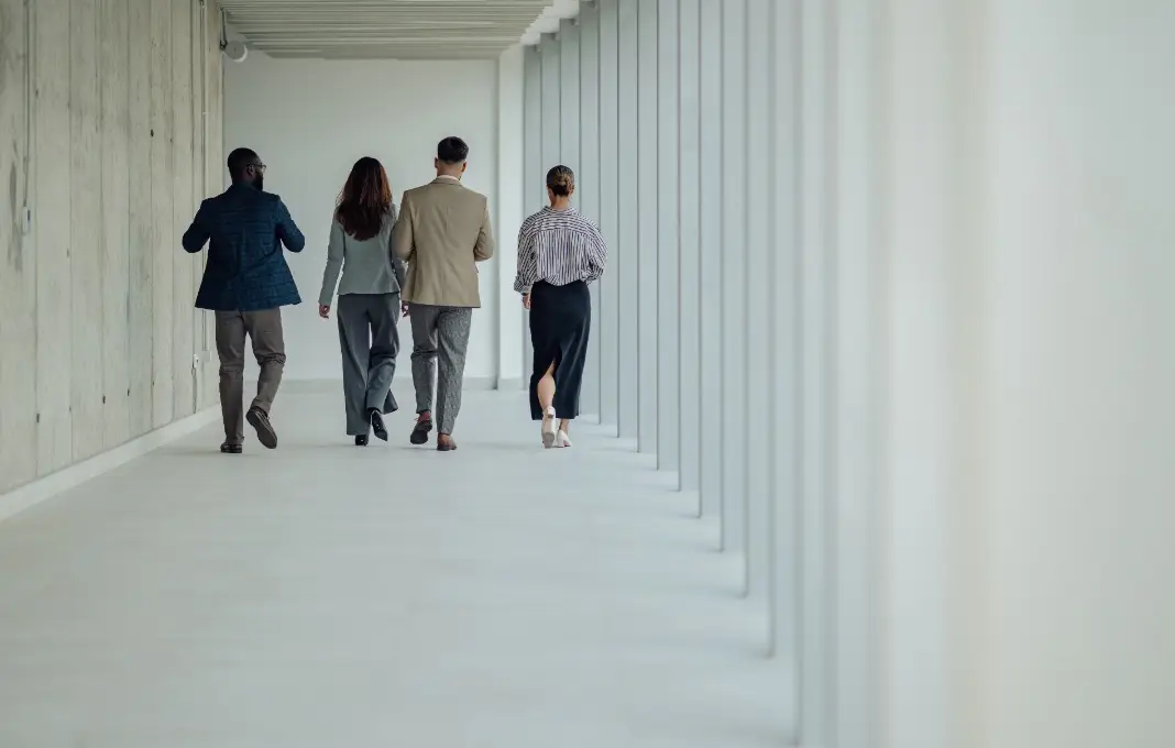 Group of business people walking away