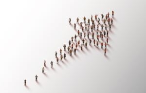 Group of people in the shape of an arrow