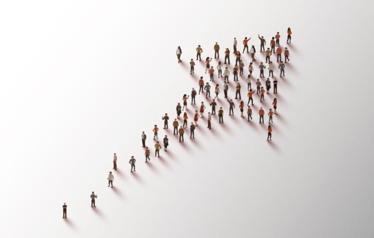 Group of people in the shape of an arrow