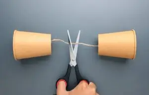 Communication breakdown and loss of connection concept with cut string phone