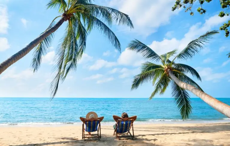 Couple relax on the beach enjoying beautiful sea on the tropical island