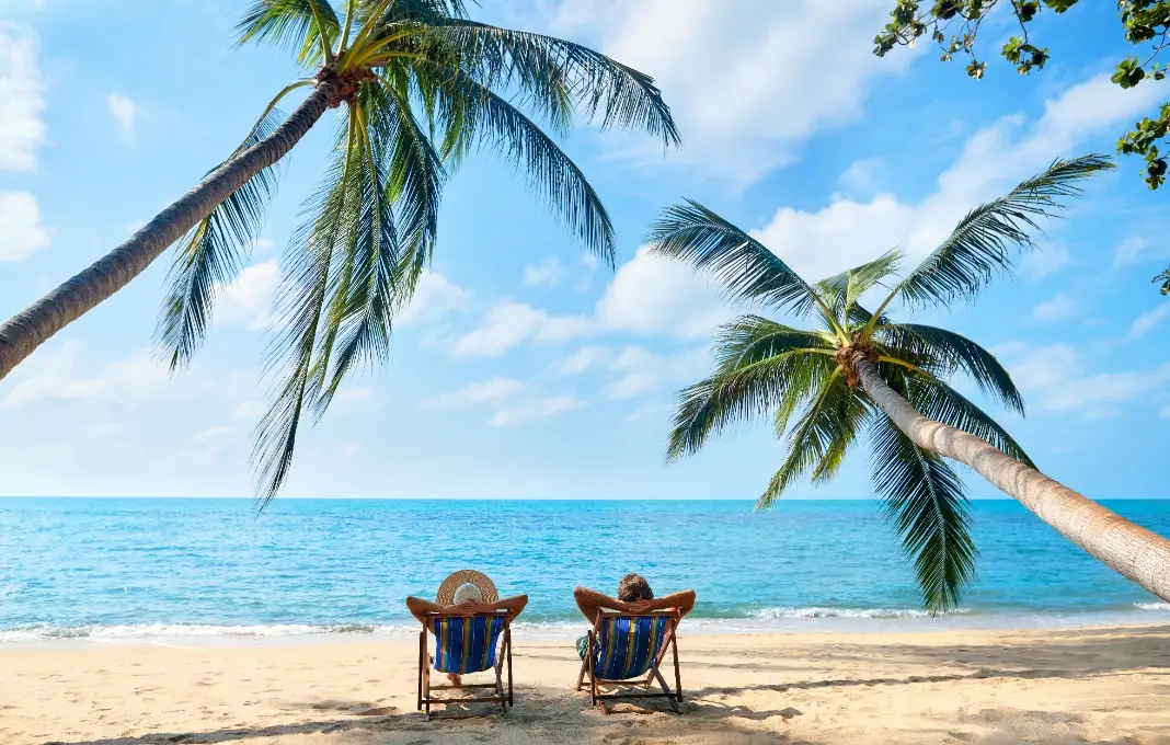 Couple relax on the beach enjoying beautiful sea on the tropical island