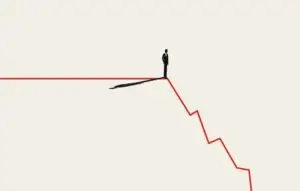 Silhouette of business man standing on descending red line