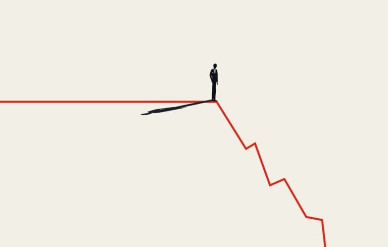 Silhouette of business man standing on descending red line