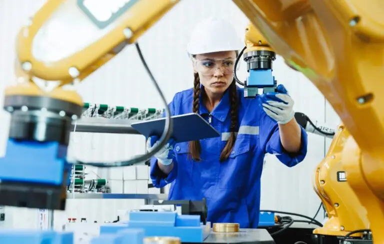 female automation machine engineer student study and inspection control robot arm machine in university or factory workshop.