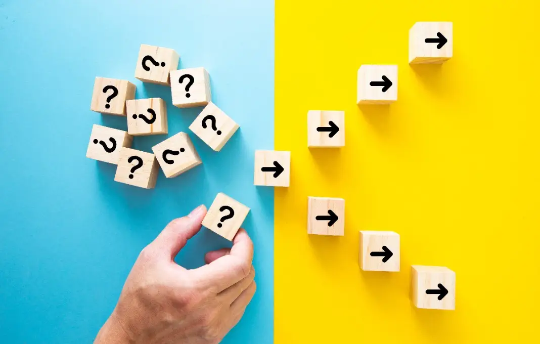Downloaded File #: 526258567 Hand choosing a block with question mark