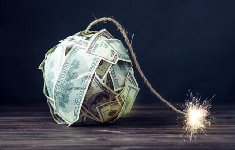 Bomb made of hundred dollar bills with a burning wick