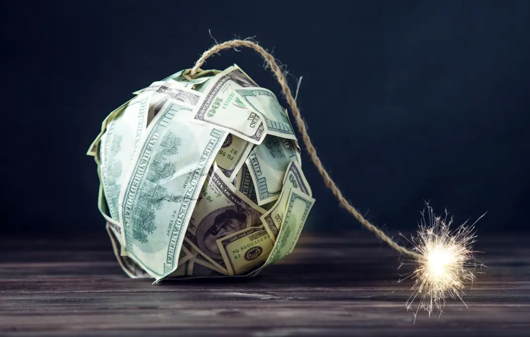 Bomb made of hundred dollar bills with a burning wick